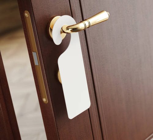 hotel room door with a hanger